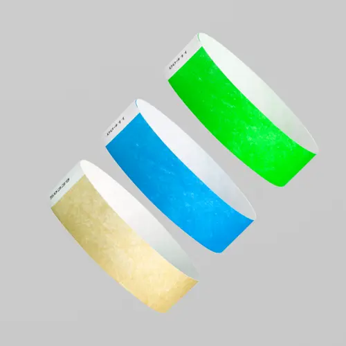 Pluseras para eventos tyvek de diferentes colores flotando. El material ideal para eventos